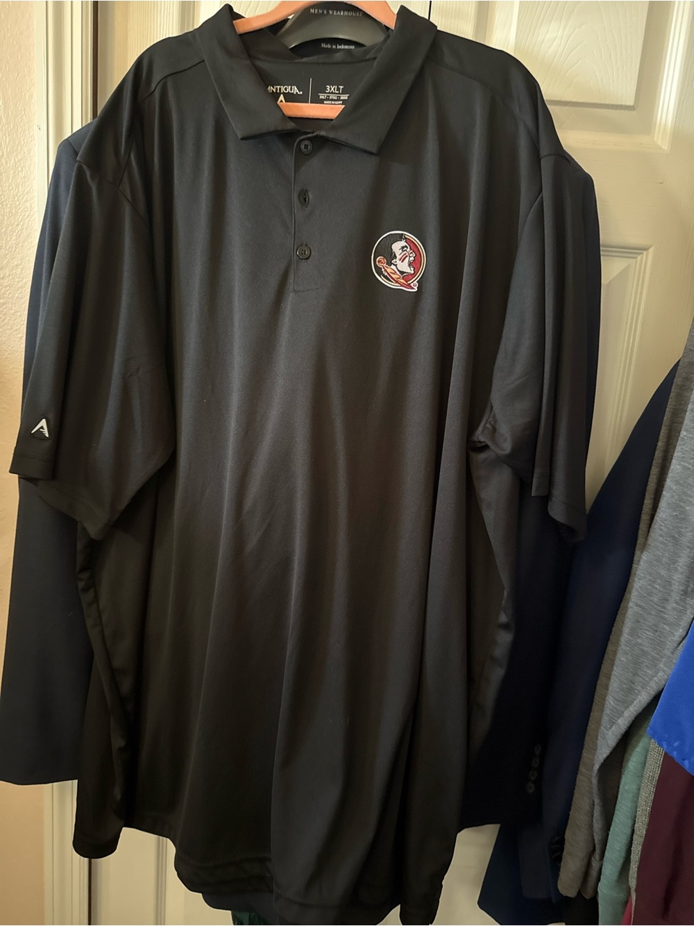 Antigua Black Polo with Embroidered Team Crest